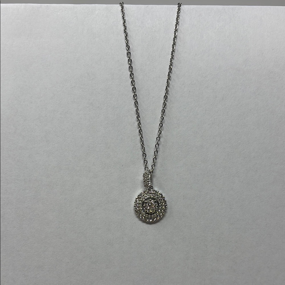 Intricate Silver Necklace with Circular Pendant